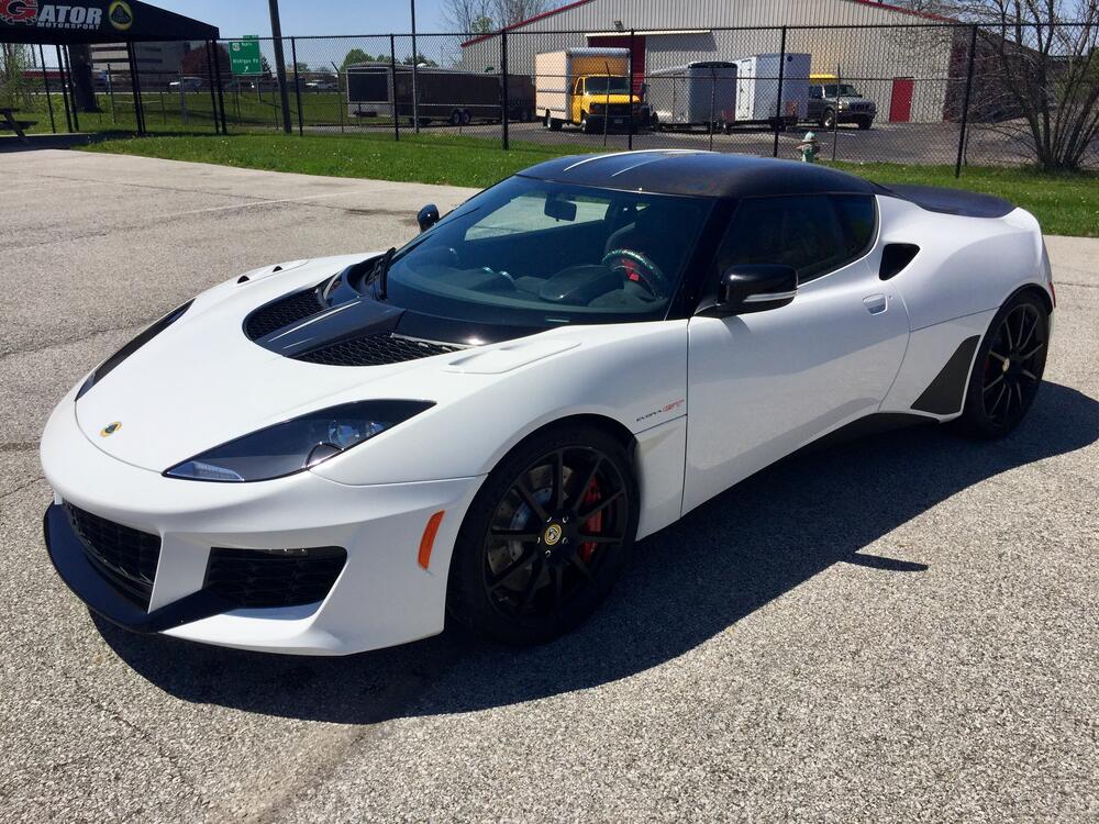 SOLD! - 2021 Lotus Evora GT 2+2 - Monaco White w/ Carbon Pack - Black  Leather & Alcantara w/ Red Stripes - 6-speed Manual w/ LSD - Thank You K.W.  from Carmel, IN! | Gator Motorsport