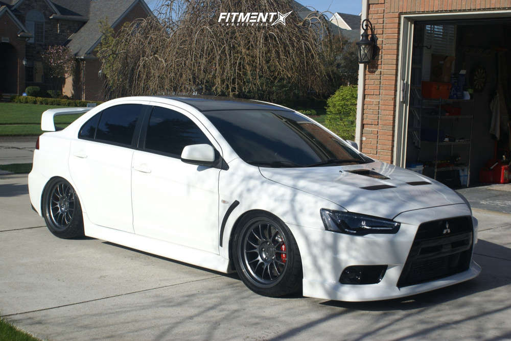 2014 Mitsubishi Lancer Evolution GSR with 18x9.5 Kansei Corsa and Nitto  275x35 on Air Suspension | 1096838 | Fitment Industries