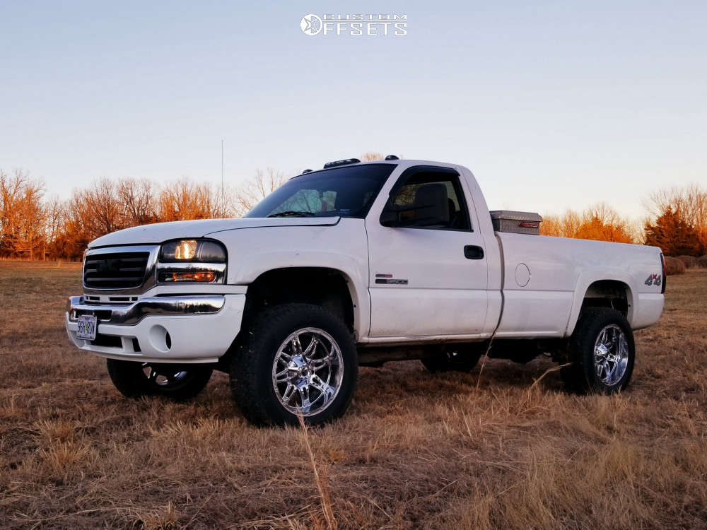 2004 GMC Sierra 3500 with 20x10 -24 Fuel Hostage and 305/55R20 Hankook  Dynapro At-m and Level 2" Drop Rear | Custom Offsets