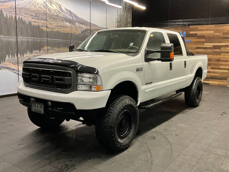 2001 Ford F-350 Lariat Crew Cab 4X4 / 7.3L DIESEL / 6-SPEED MANUAL BRAND  NEW 4" LIFT KIT w/ BRAND NEW WHEELS & TIRES / 6-SPEED / RUST FREE / ONLY  115,000 MILES / SHARP & CLEAN