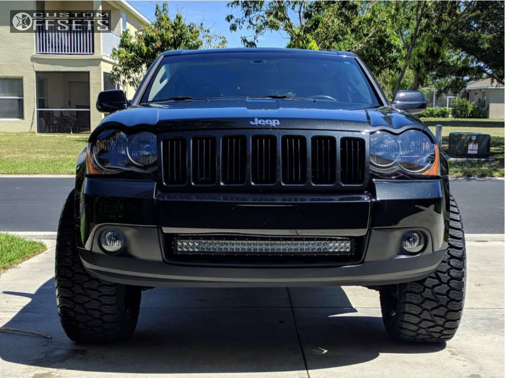 2009 Jeep Grand Cherokee with 20x10 -25 Ultra Menace and 305/55R20 AMP  Terrain Attack AT A and Leveling Kit | Custom Offsets