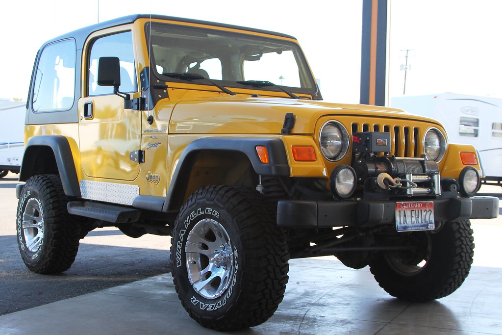 Yellow 2001 Jeep Wrangler Sport | with a 4" lift, K&N Cold a… | Flickr