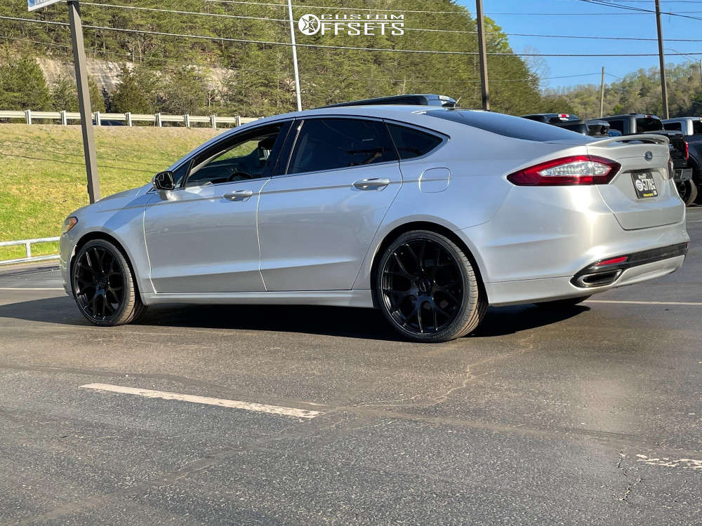 2014 Ford Fusion with 20x8.5 38 Ravetti M8 and 245/35R20 Ironman Imove Gen2  As and Stock | Custom Offsets