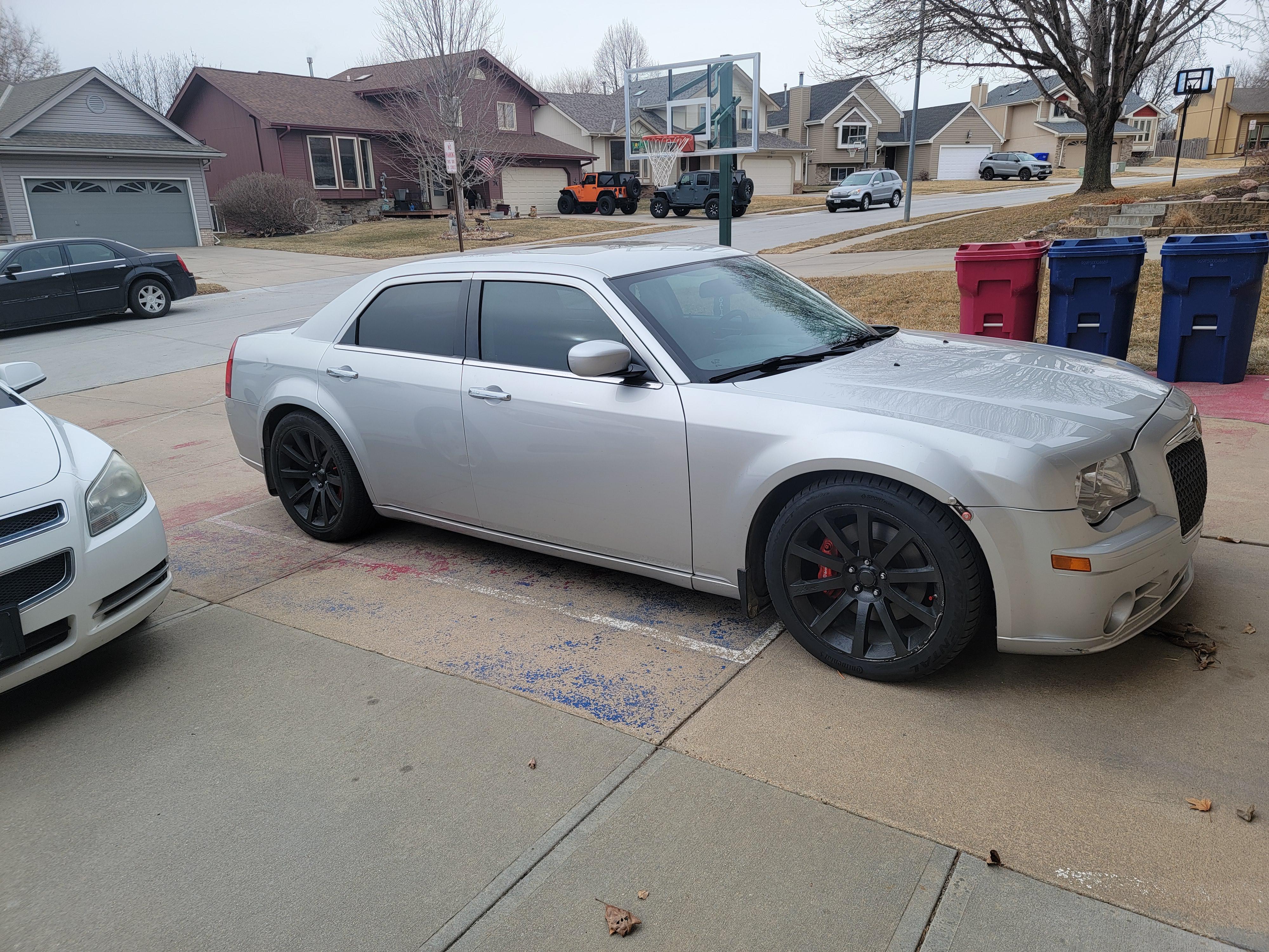 My new baby, 2010 Chrysler 300 SRT8, as you can see in the back I also have  another 2005 Chryslee 300 Touring which I've owned for the last 13 years.  I've always