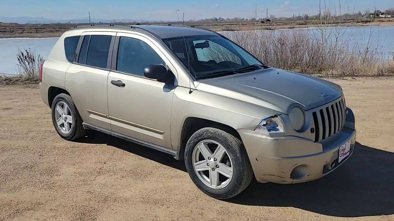 Pre-Owned 2009 JEEP COMPASS SPORT SUV UP #W9294-65 in Greeley | CarHop