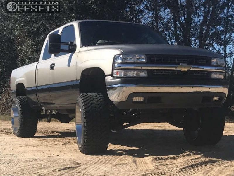 1999 Chevrolet Silverado 2500 with 24x14 -76 Hostile Alpha and 35/13.5R24  AMP Mud Terrain Attack MT A and Suspension Lift 6" | Custom Offsets
