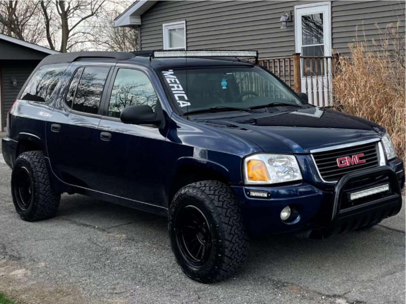 2004 GMC Envoy XUV with 17x9 -12 KMC Km542 and 265/70R17 Venom Power Terra  Hunter X/t and Suspension Lift 3" | Custom Offsets